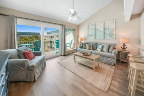 Cozy and Bright condo on private section of beach with a pool!